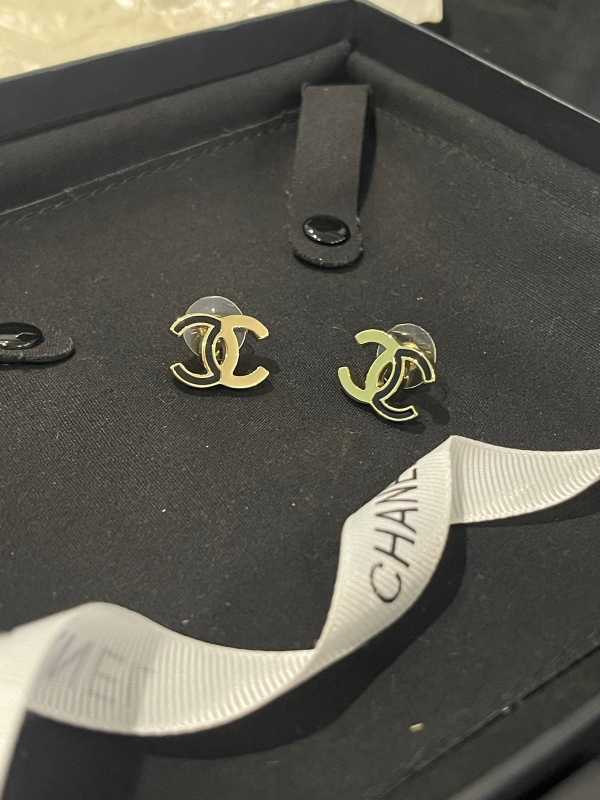 Double-C Emblem Stud Earrings in Polished Metal-Tone – Black Detail – Design 003 front product view