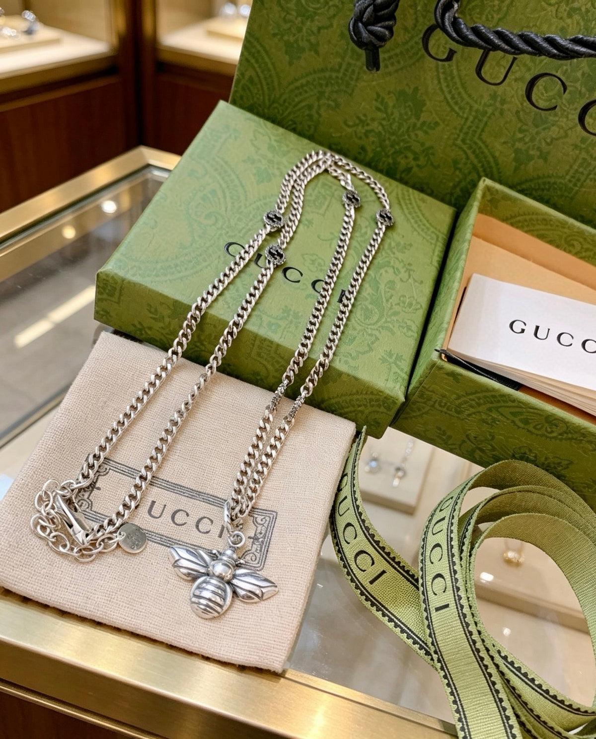 Double-G Emblem Pendant Necklace in Polished Metal-Tone – Bee Detail main product view