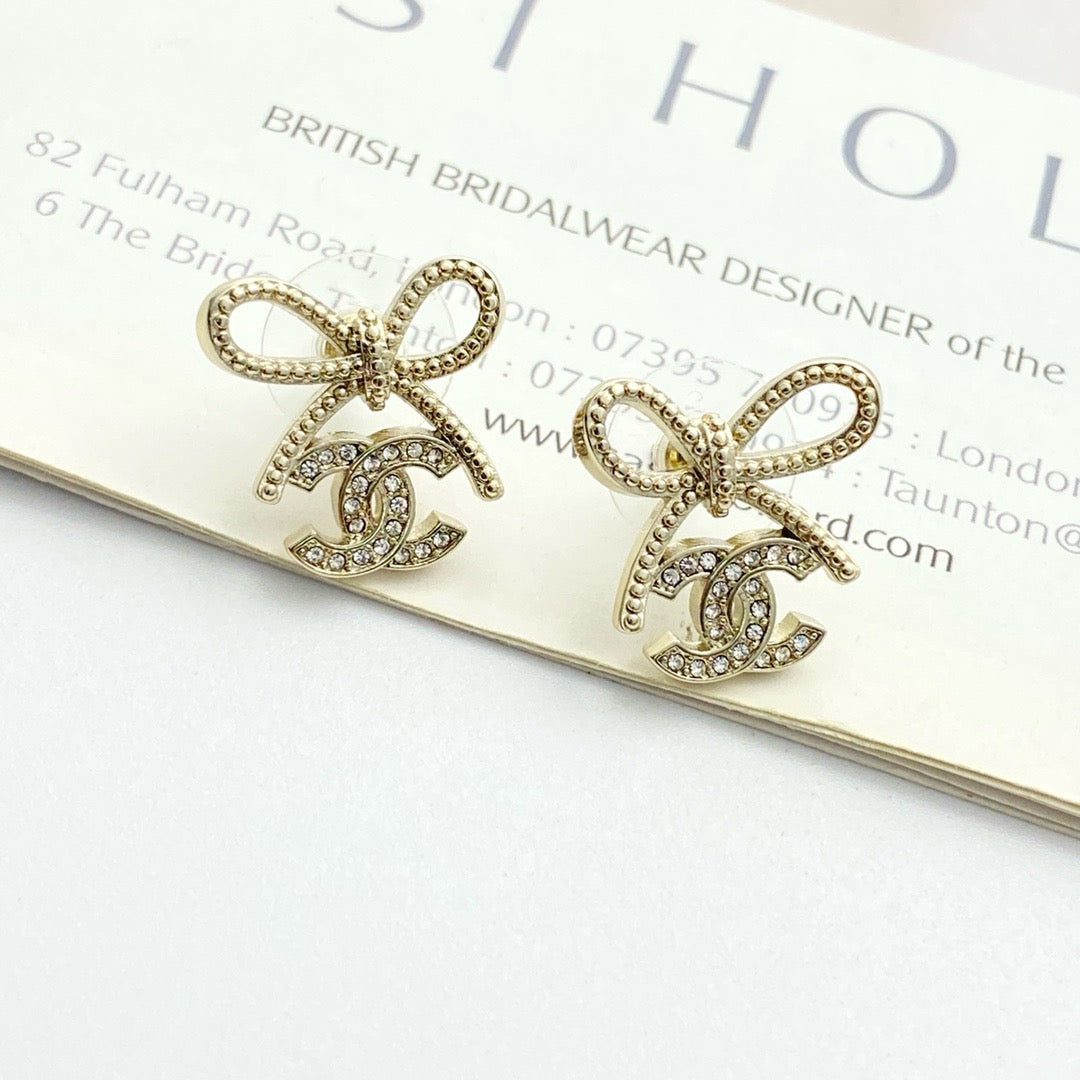 Double-C Emblem Stud Earrings in Polished Metal-Tone – Design 283 close-up detail