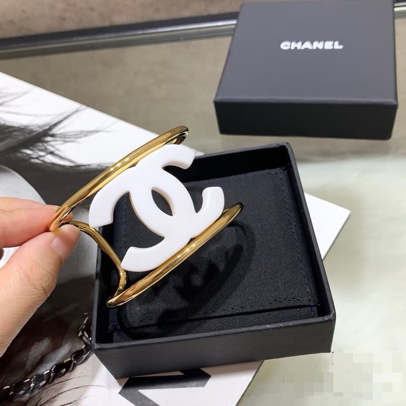 Signature Emblem Bangle in Polished Metal-Tone – White Detail – Design 002 front product view