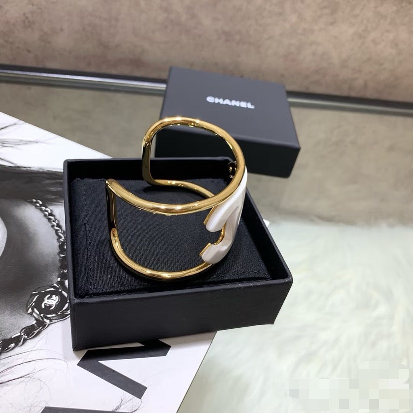 Signature Emblem Bangle in Polished Metal-Tone – White Detail – Design 002 main product view