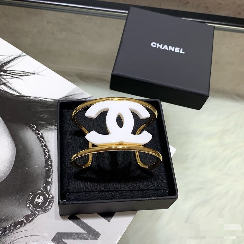 Signature Emblem Bangle in Polished Metal-Tone – White Detail – Design 002 main product view