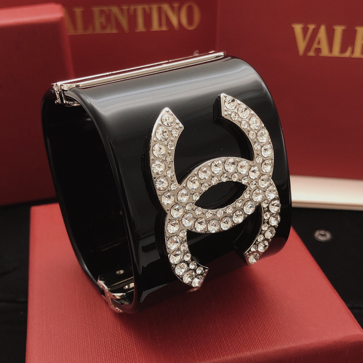Signature Emblem Bangle in Silver-Tone – Black Detail front product view
