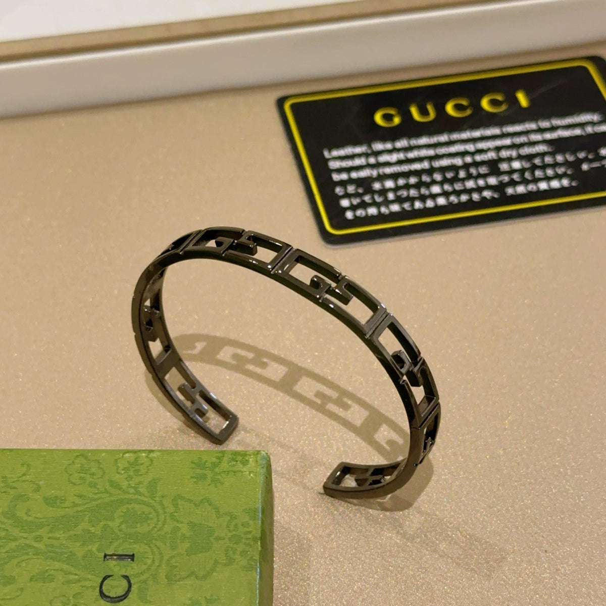 Double-G Emblem Bangle in Polished Metal-Tone – Design 025 front product view