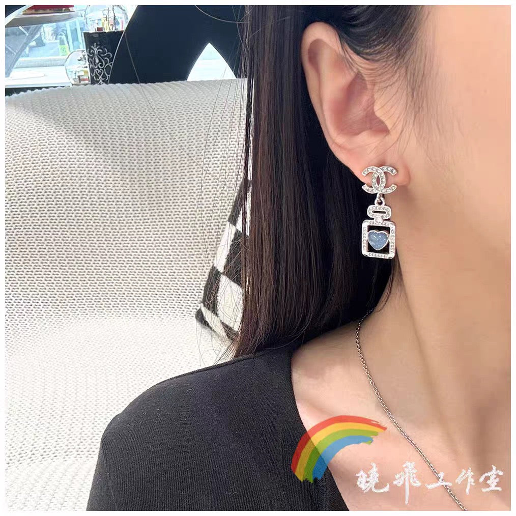 Signature Emblem Stud Earrings in Polished Metal-Tone – Design 056 front product view