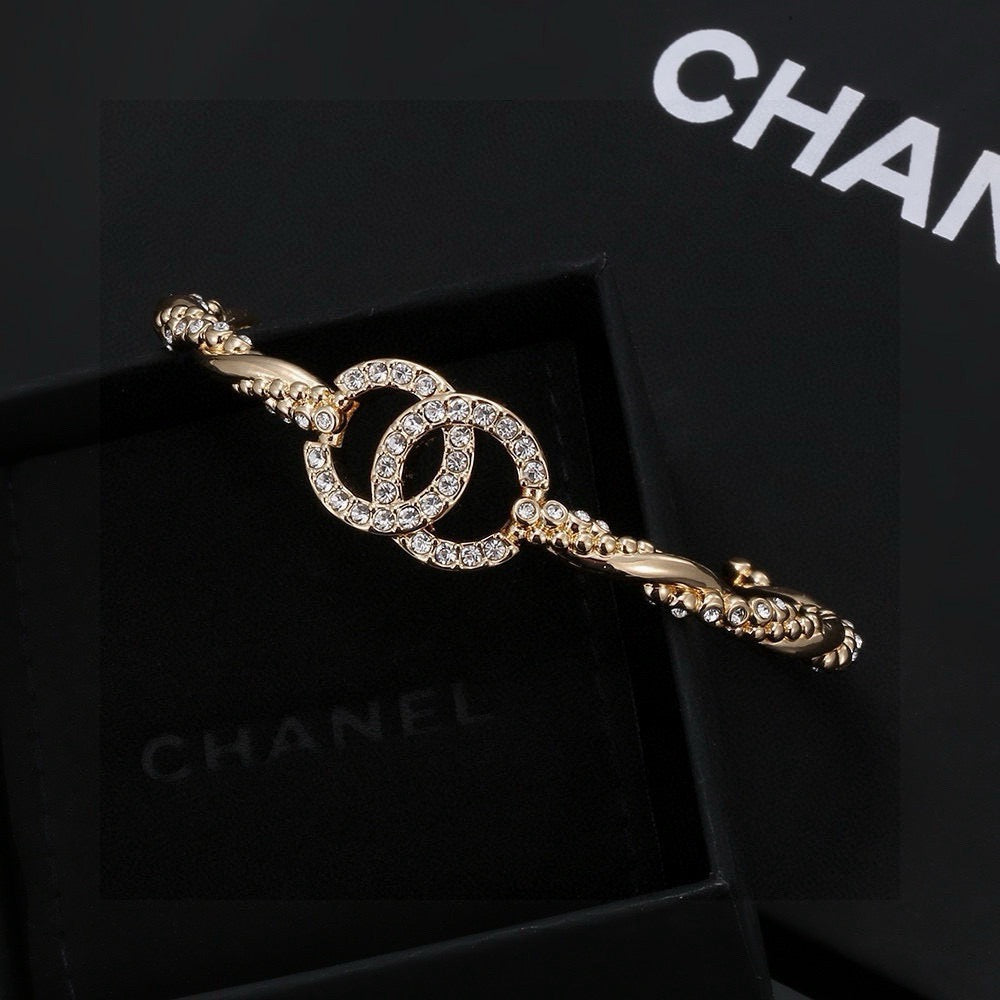 Signature Emblem Bangle in Polished Metal-Tone – Design 028 front product view