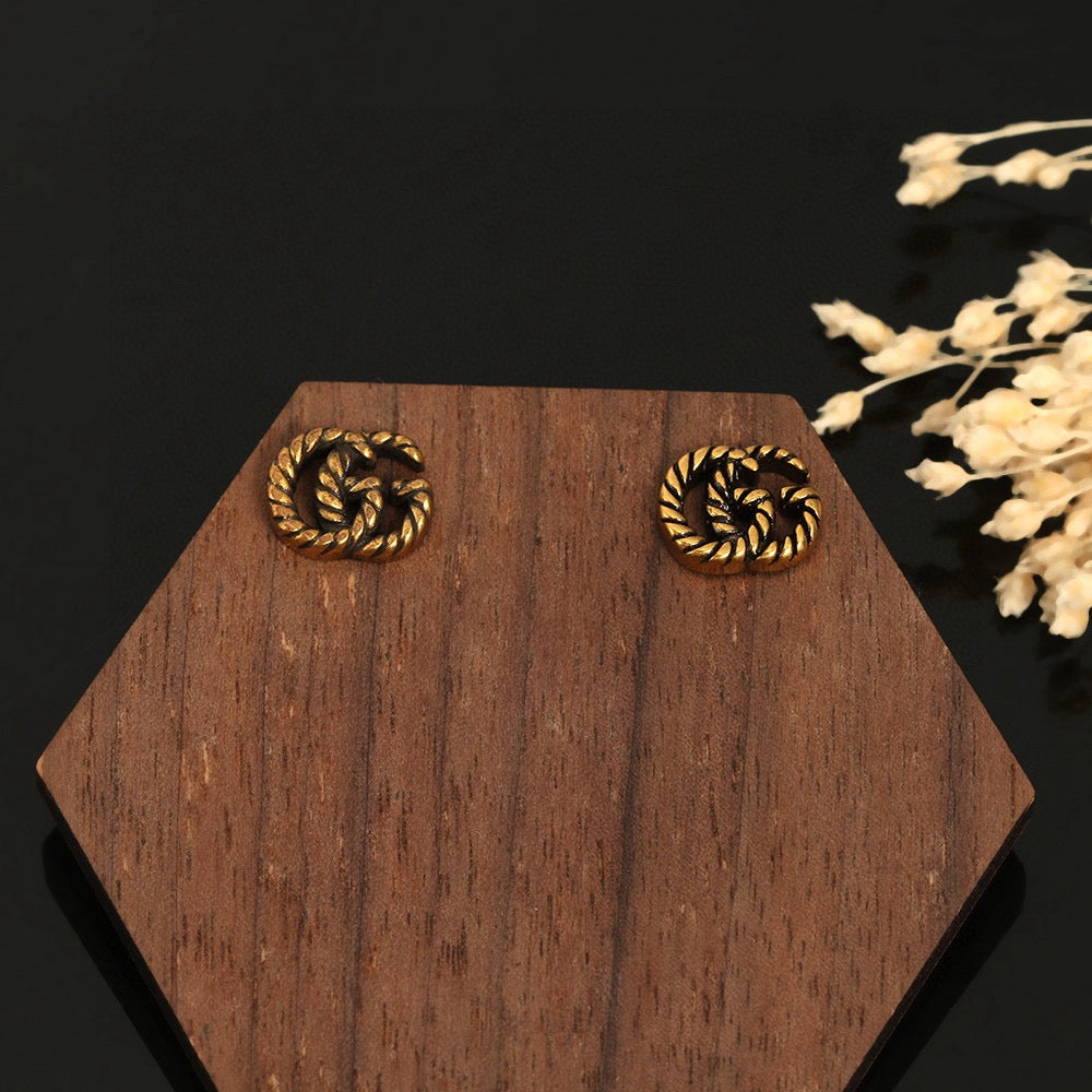 Geometric Emblem Stud Earrings in Polished Metal-Tone – Design 040 close-up detail