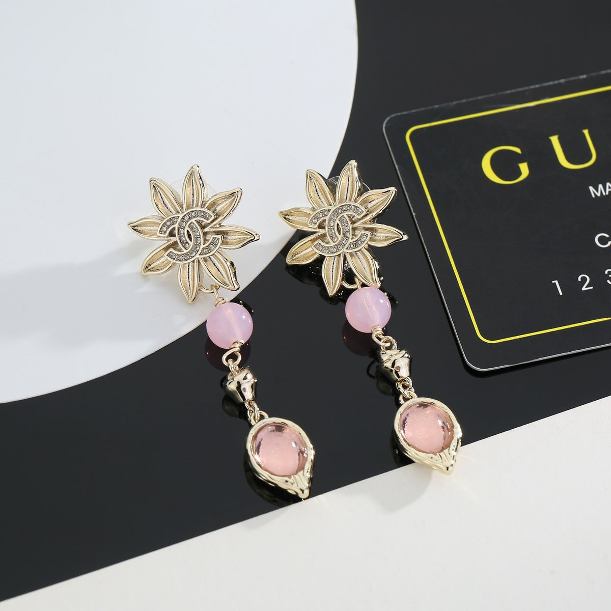 Double-C Emblem Stud Earrings in Gold-Tone – Design 028 detail view