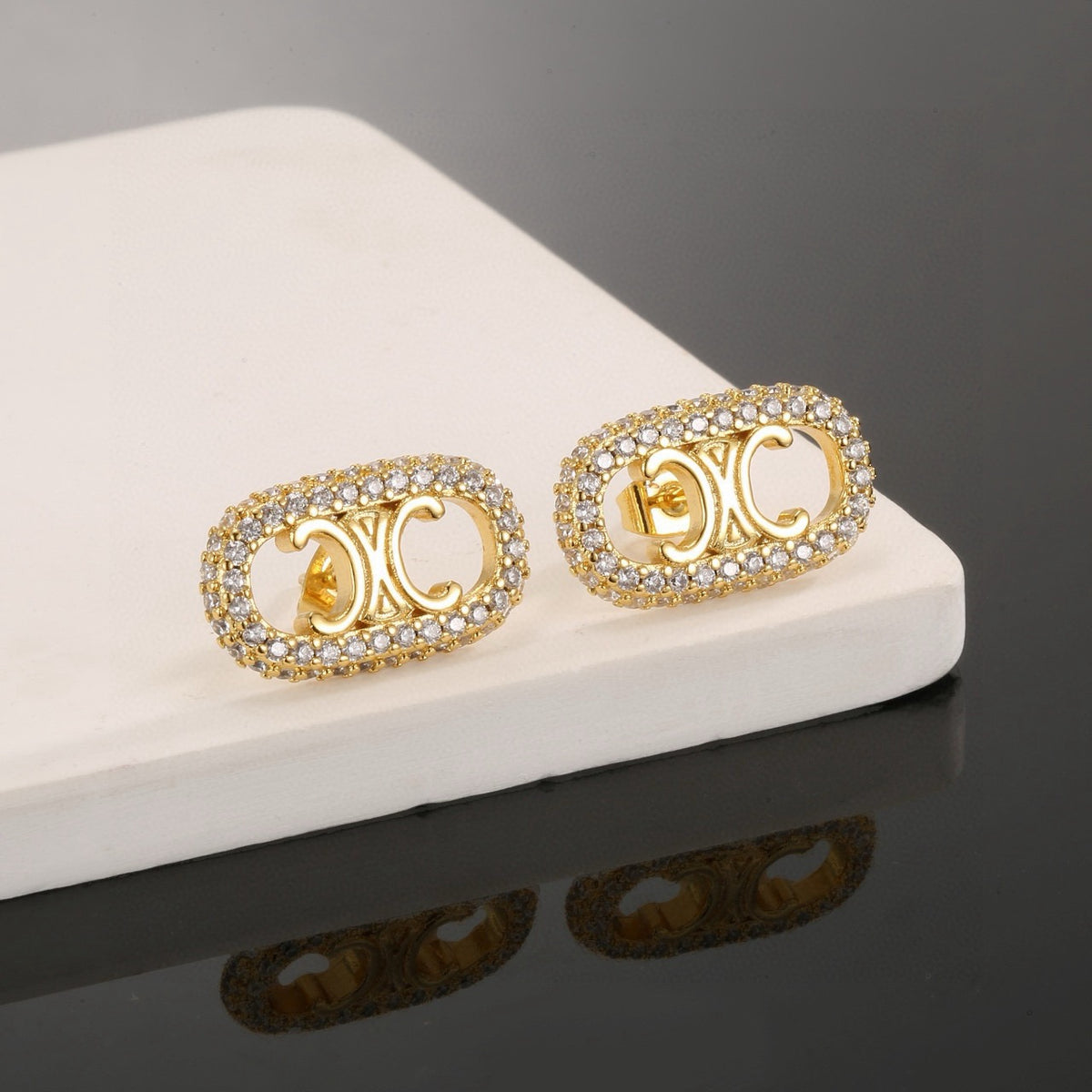 Signature Emblem Stud Earrings in Gold-Tone – Design 04 styled detail