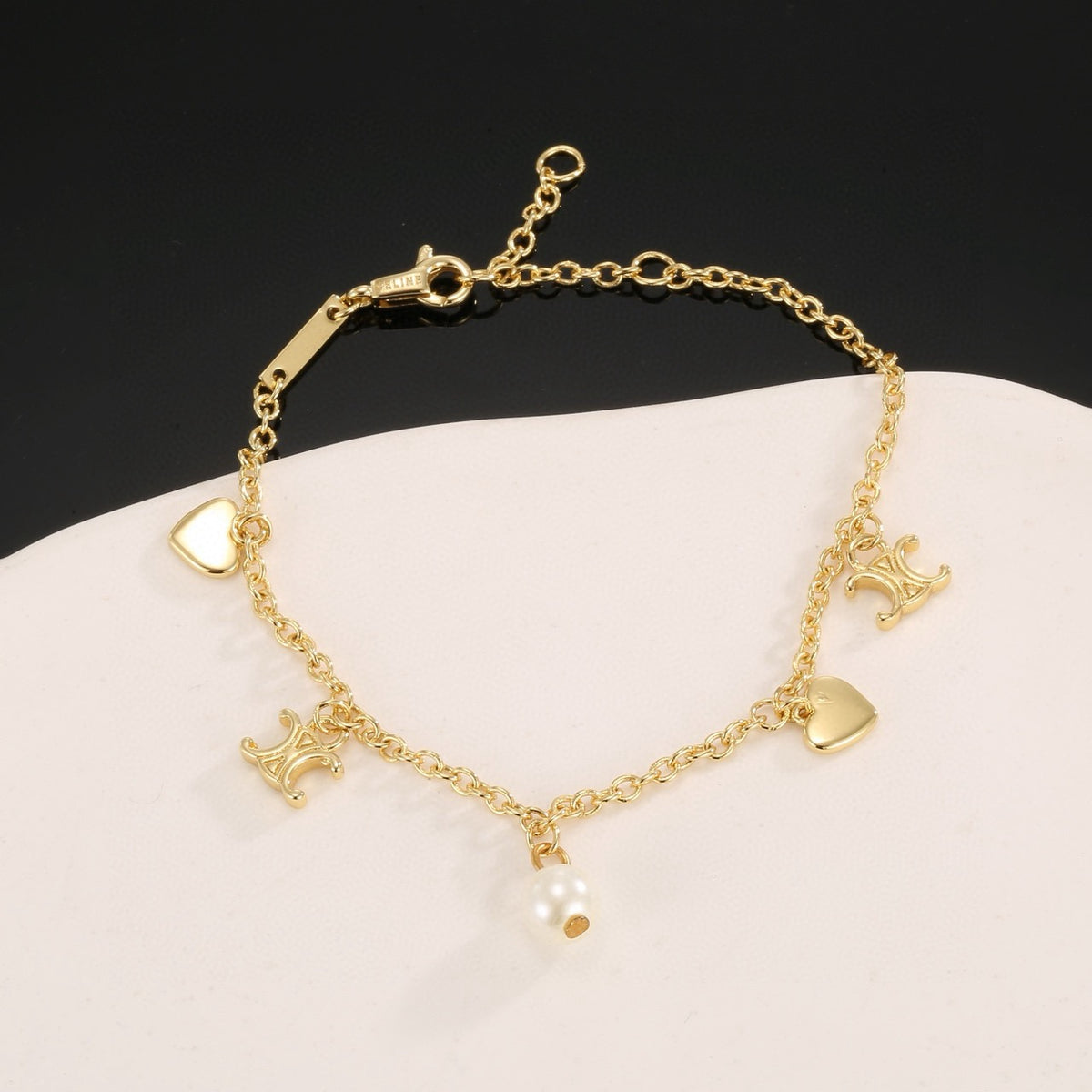 Triomphe-Inspired Emblem Bracelet in Gold-Tone – Red styled detail