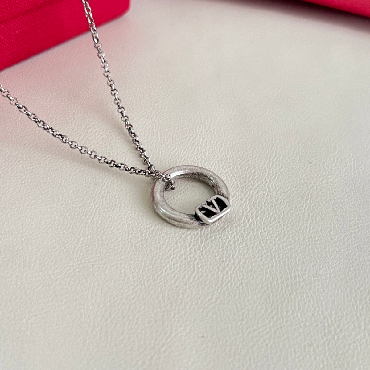 Signature Emblem Pendant Necklace in Polished Metal-Tone – Design 02 close-up view
