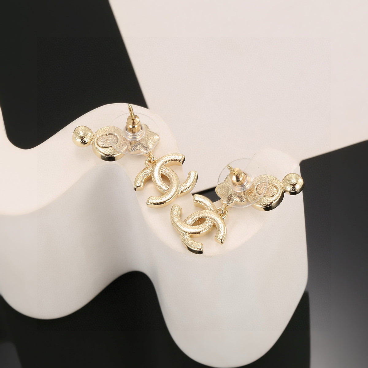Double-C Emblem Stud Earrings in Gold-Tone – Star Detail – Design 006 styled product view
