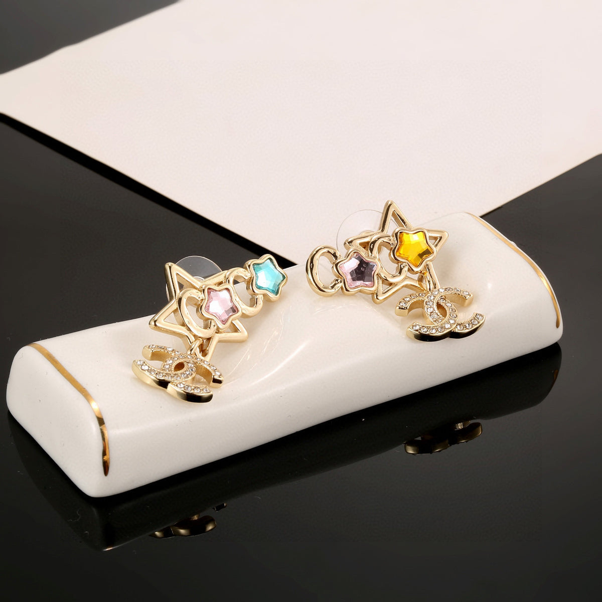 Double-C Emblem Stud Earrings in Gold-Tone – Star Detail – Design 005 side detail
