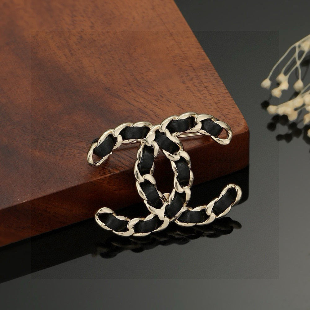 Signature Emblem Brooch in Polished Metal-Tone – Black Detail – Design 002 front product view