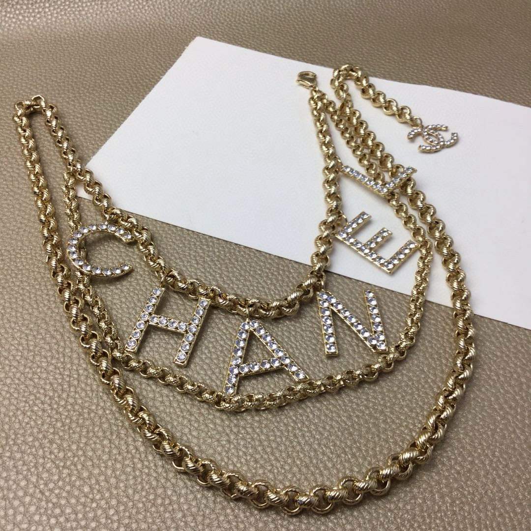 Signature Emblem Jewelry Accessory in Gold-Tone – White Detail – Design 004 side detail