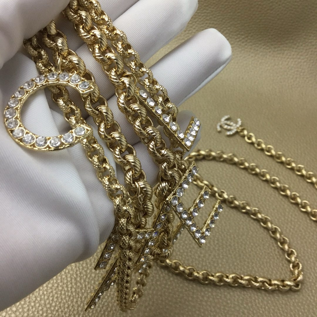 Signature Emblem Jewelry Accessory in Gold-Tone – White Detail – Design 004 main product view