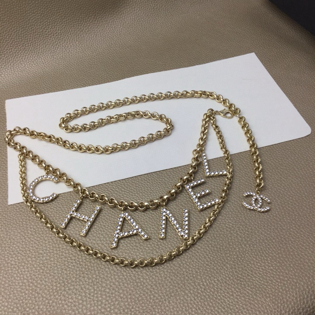 Signature Emblem Jewelry Accessory in Gold-Tone – White Detail – Design 004 front product view