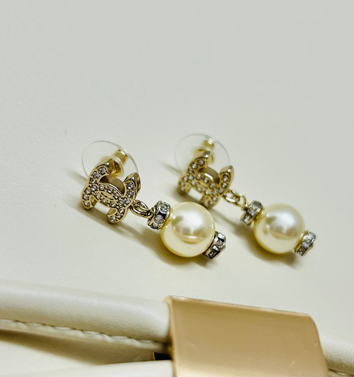 Signature Emblem Stud Earrings in Polished Metal-Tone – Design 064 detail view