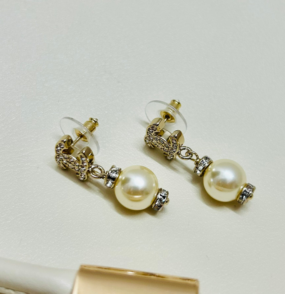Signature Emblem Stud Earrings in Polished Metal-Tone – Design 064 close-up detail