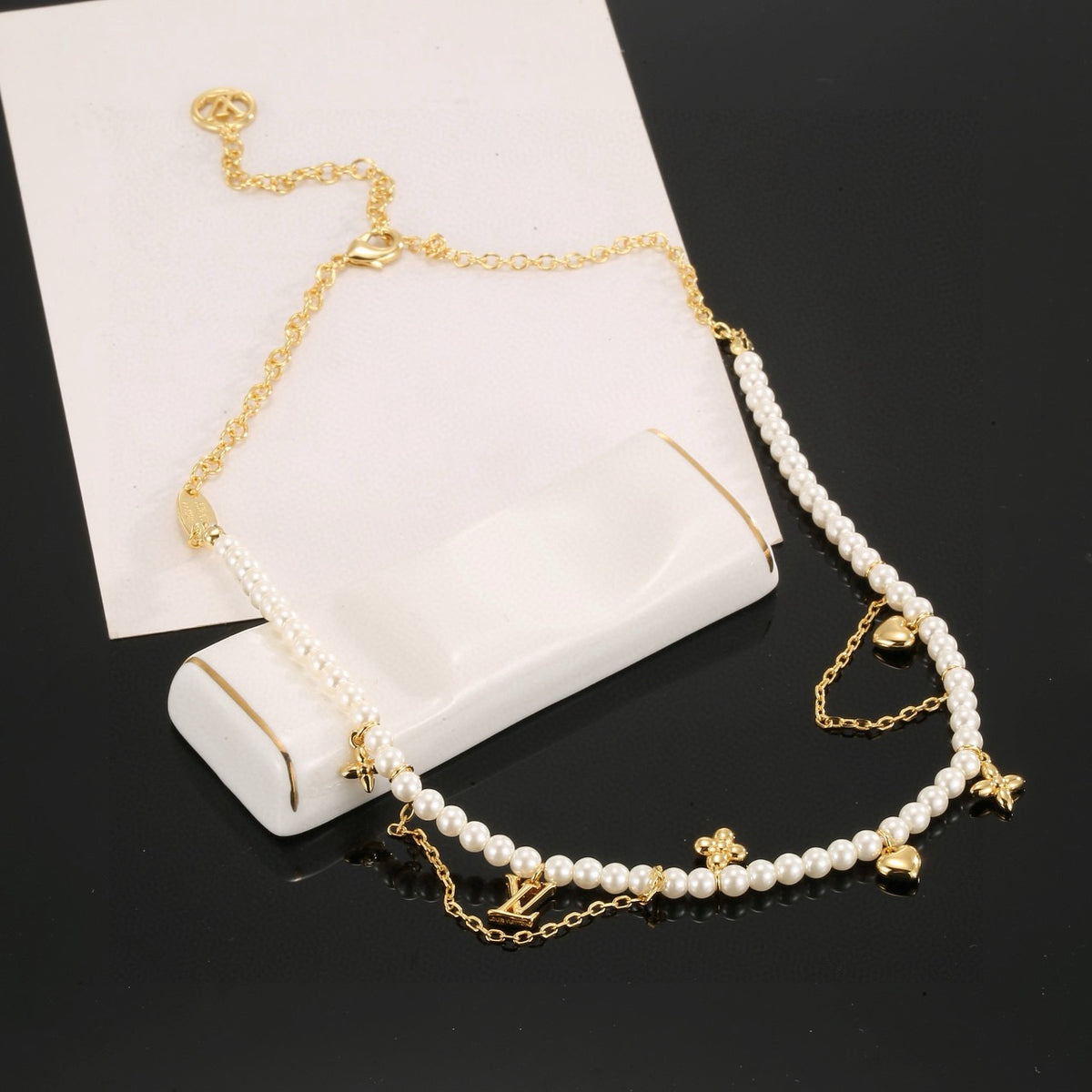 Letter Emblem Pendant Necklace in Polished Metal-Tone – Pearl Detail close-up detail