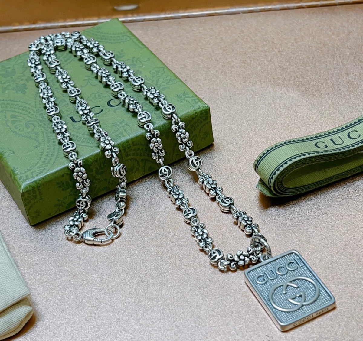 Double-G Emblem Pendant Necklace in Polished Metal-Tone – Vintage Detail – Design 050 close-up detail