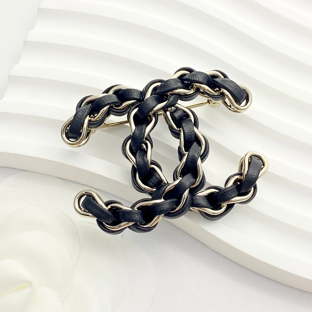 Signature Emblem Brooch in Polished Metal-Tone – Black Detail – Design 003 close-up detail