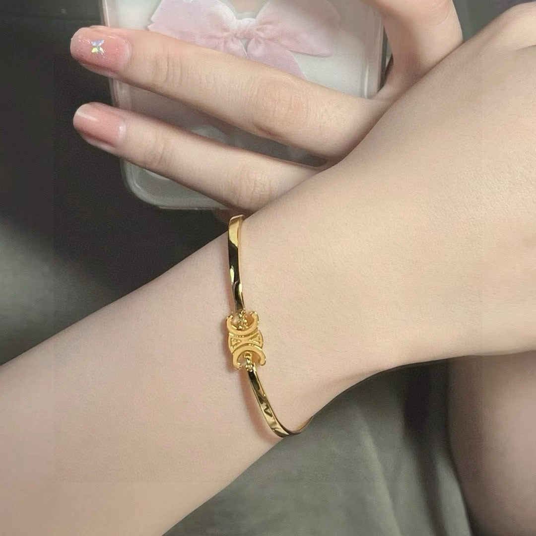 Signature Emblem Bangle in Polished Metal-Tone – Red Detail detail view