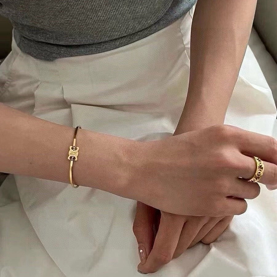 Triomphe-Inspired Emblem Cuff Bracelet in Gold-Tone detail view