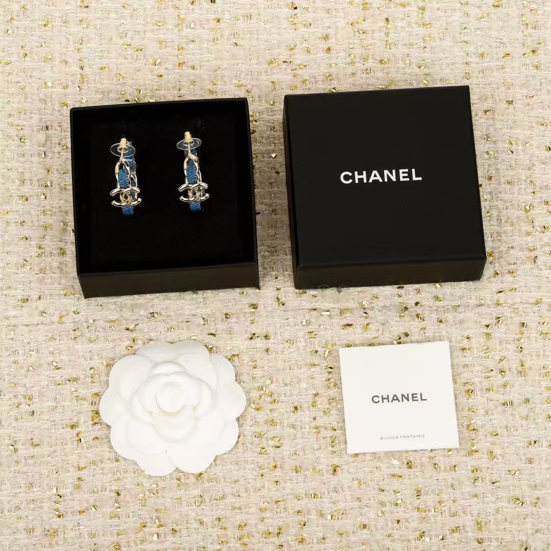 Signature Emblem Crystal-Accent Stud Earrings – Blue Detail styled product view