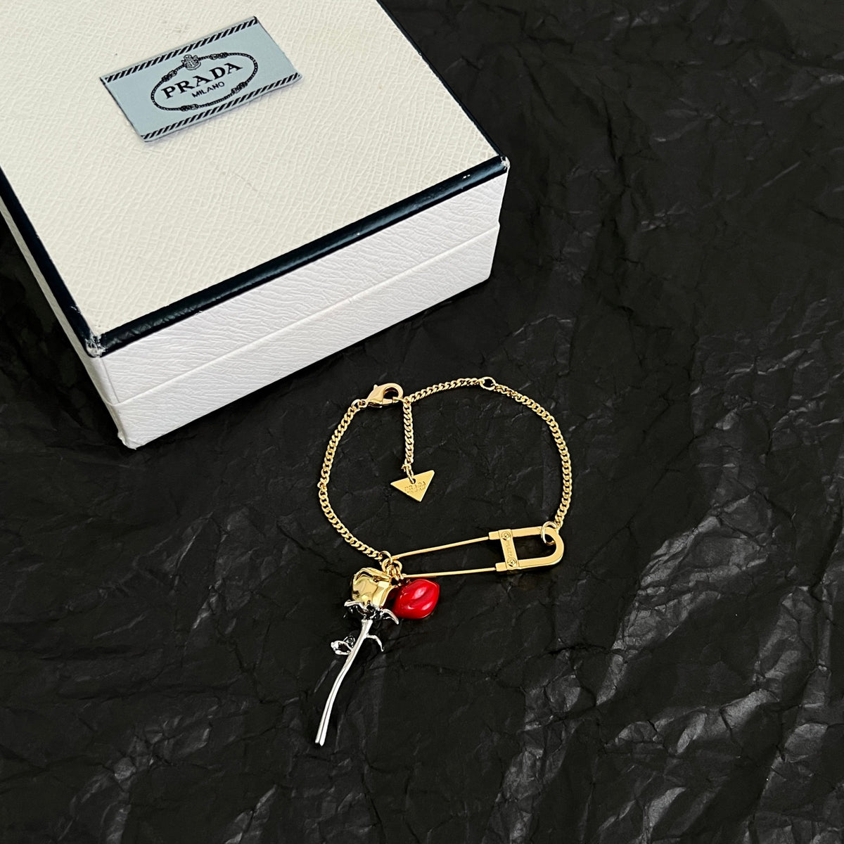 Signature Emblem Bracelet in Polished Metal-Tone detail view