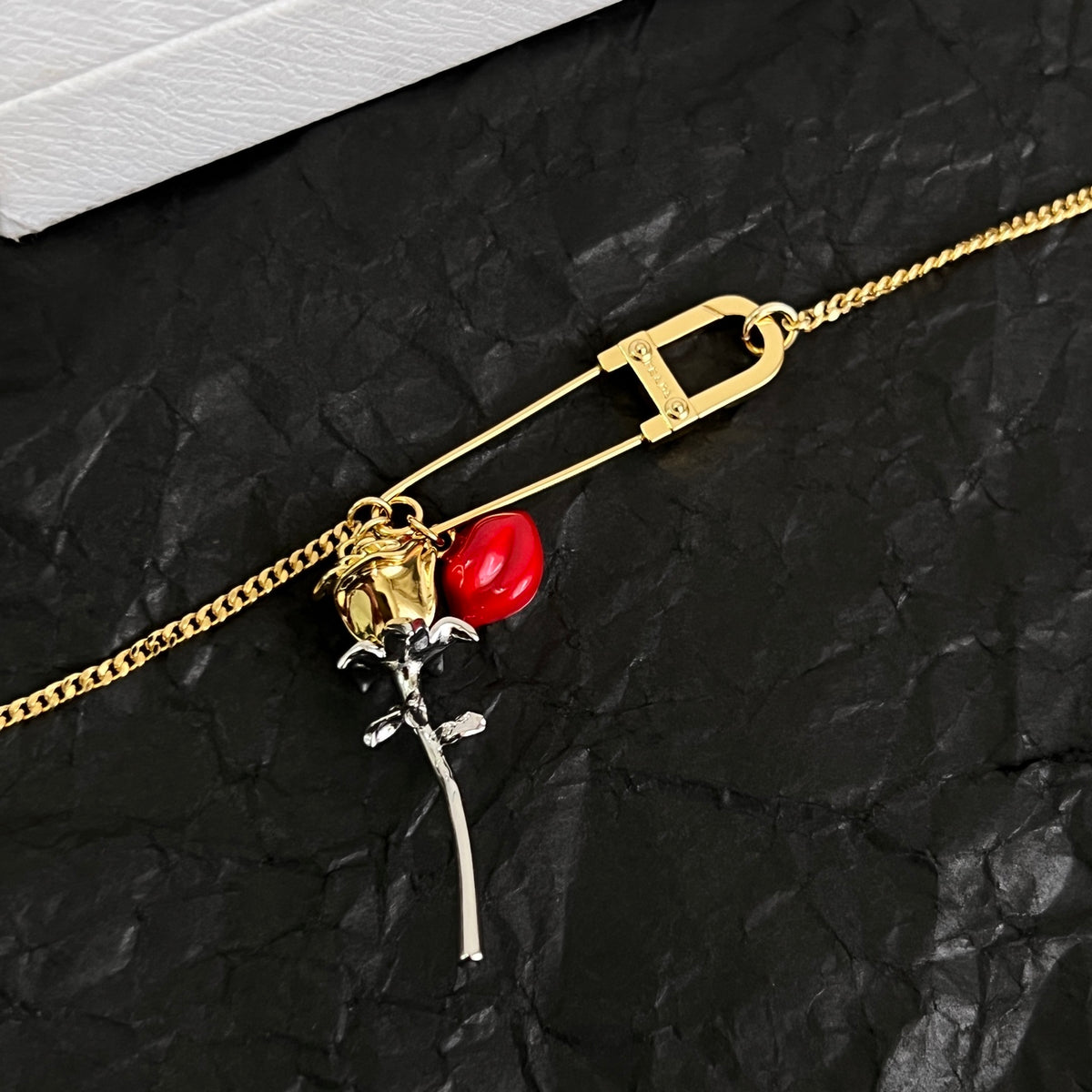 Signature Emblem Bracelet in Polished Metal-Tone styled detail