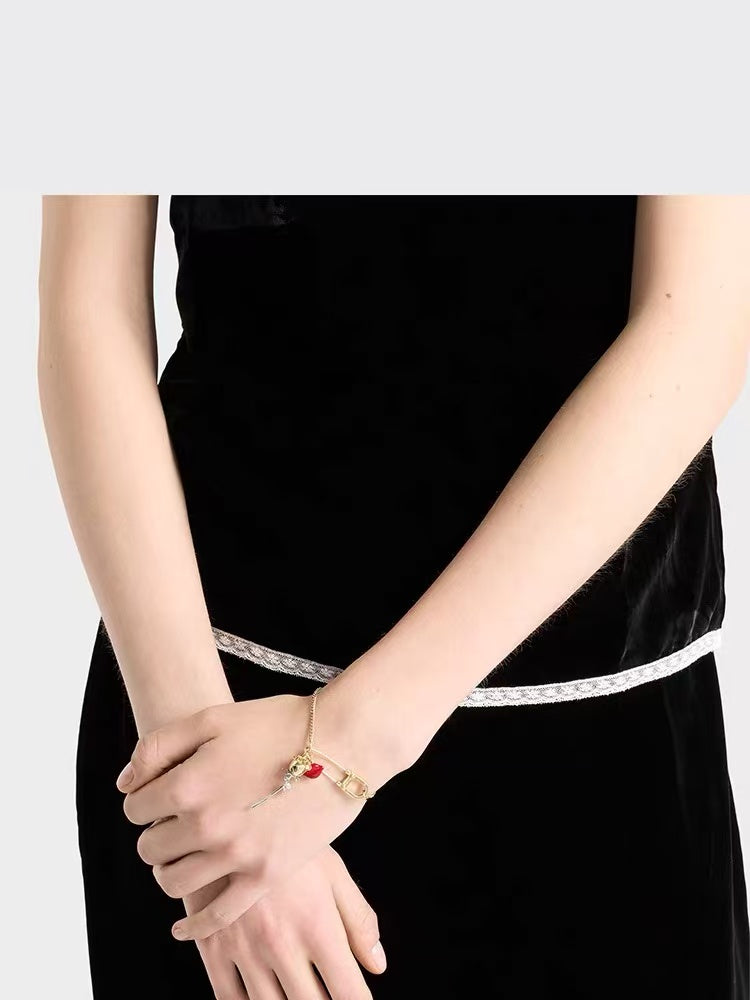Signature Emblem Bracelet in Polished Metal-Tone front view