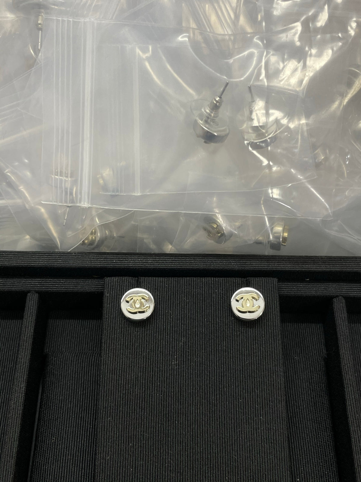 Double-C Emblem Stud Earrings in Polished Metal-Tone – Design 324 front product view