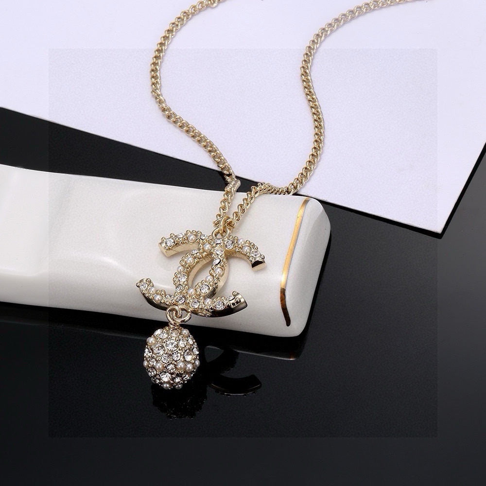 Double-C Emblem Pearl-Detail Pendant Necklace – Pearl Detail – Design 097 close-up detail