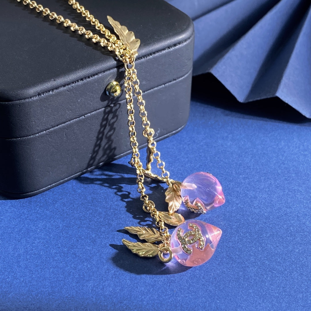 Double-C Emblem Crystal-Accent Pendant Necklace – Pink Detail – Design 003 close-up detail
