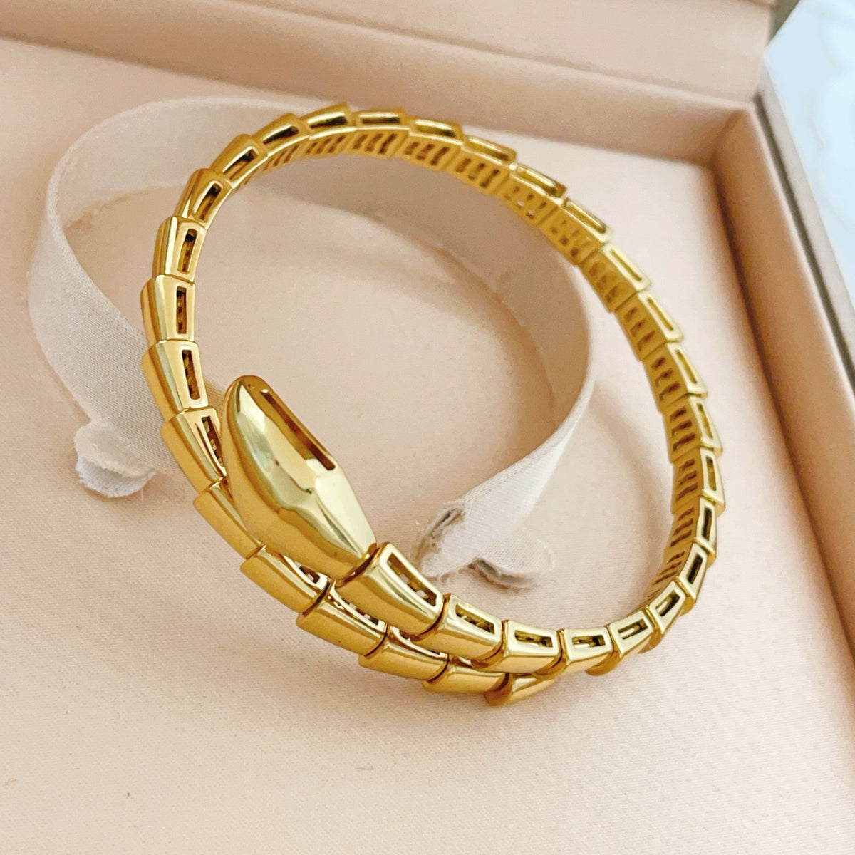 Serpentine Bangle in Gold-Tone close-up detail
