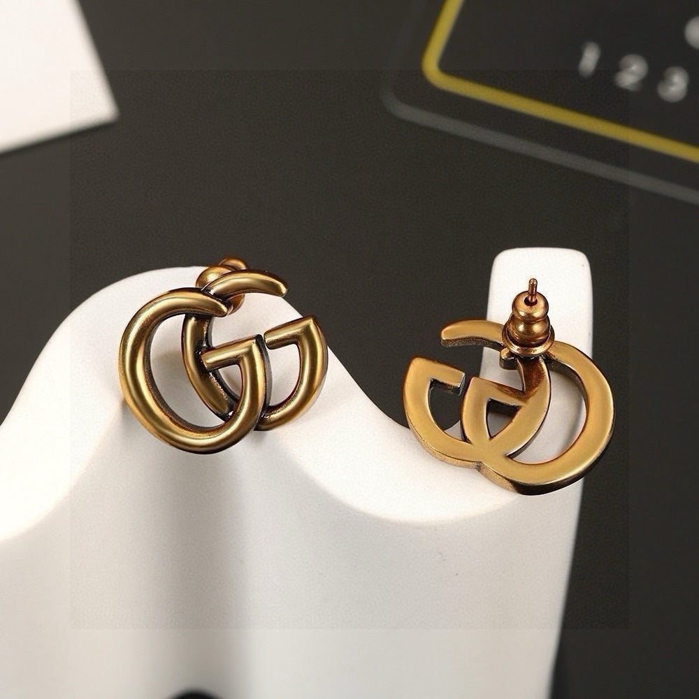Geometric Emblem Stud Earrings in Polished Metal-Tone – Design 008 styled product view