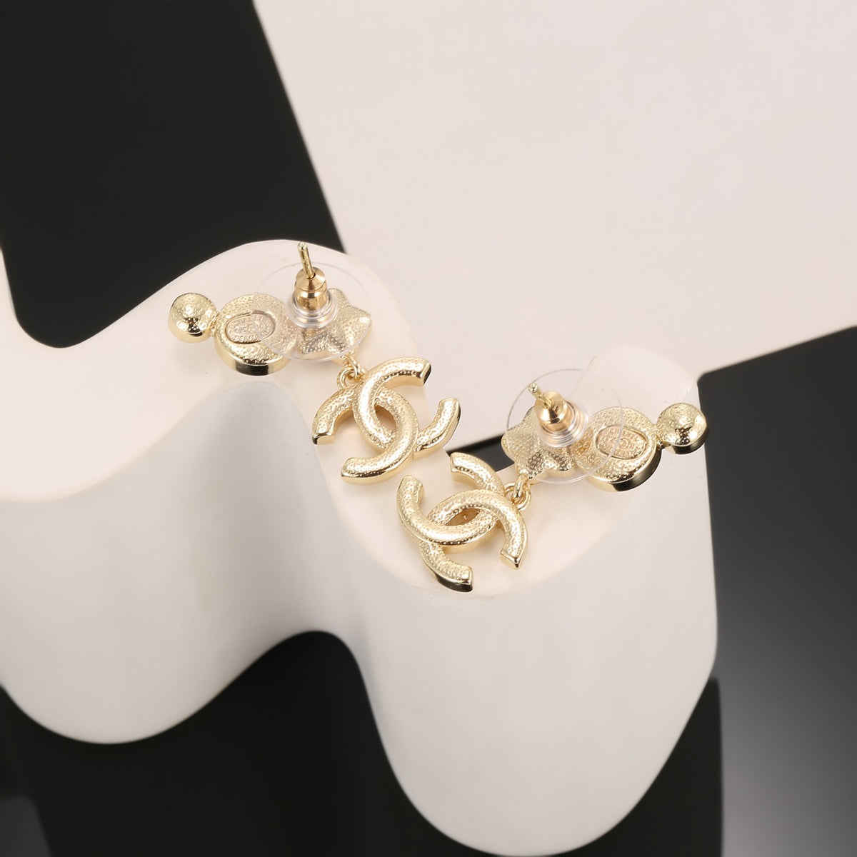 Double-C Emblem Stud Earrings in Gold-Tone – Star Detail – Design 003 side detail