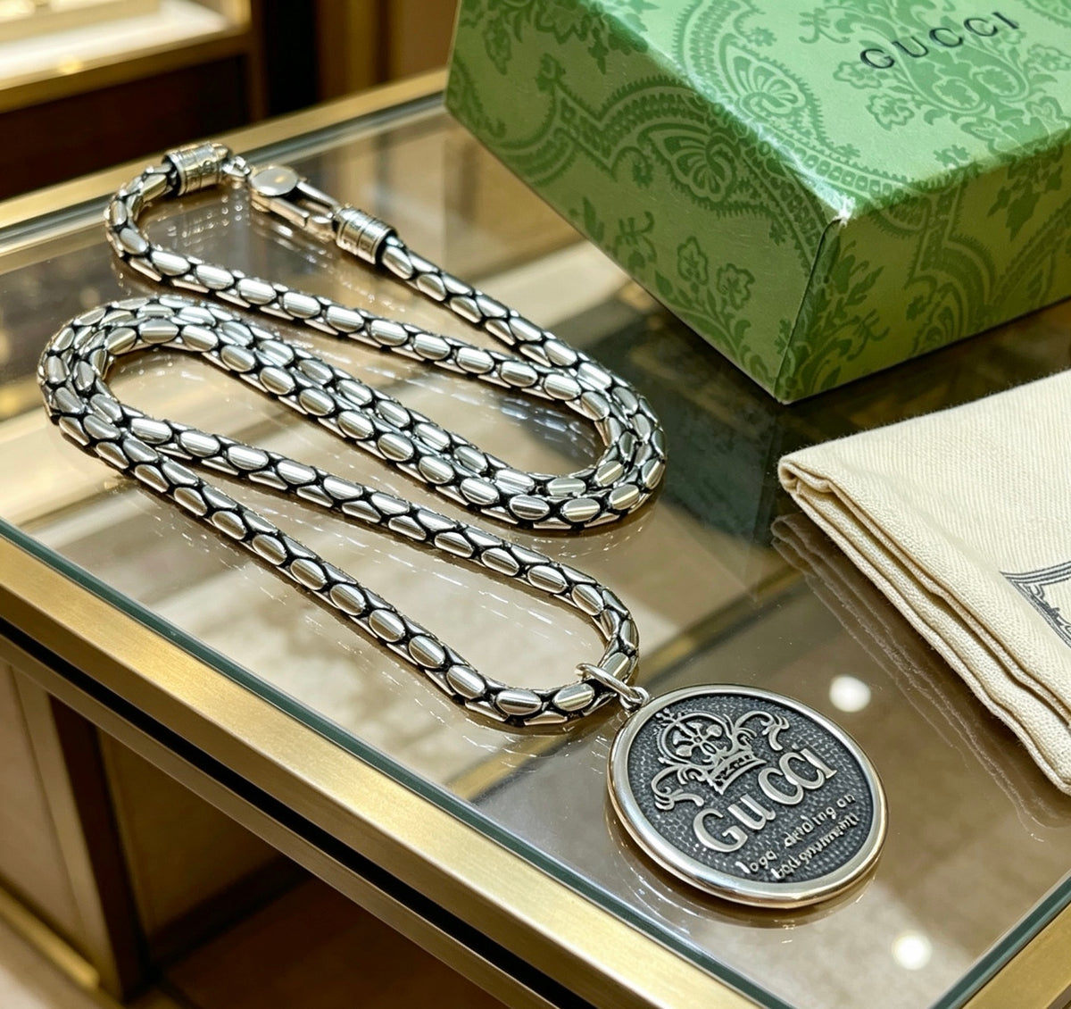 Double-G Emblem Pendant Necklace in Polished Metal-Tone – Design 062 close-up detail