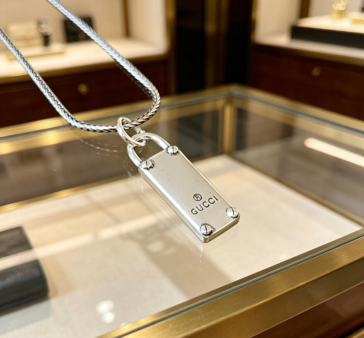Double-G Emblem Pendant Necklace in Polished Metal-Tone – Design 061 close-up detail