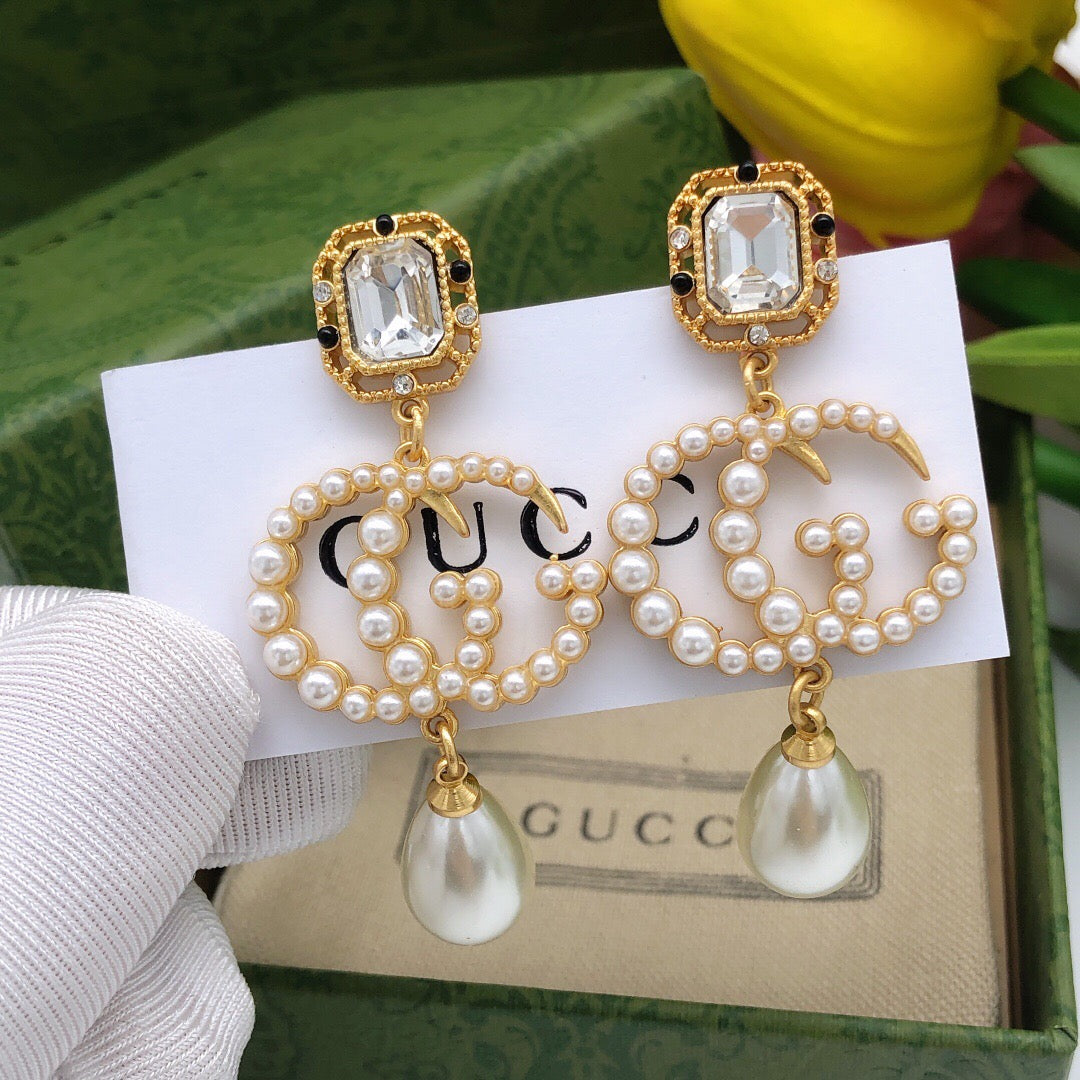 Geometric Emblem Stud Earrings in Polished Metal-Tone – Crystal Detail main product view