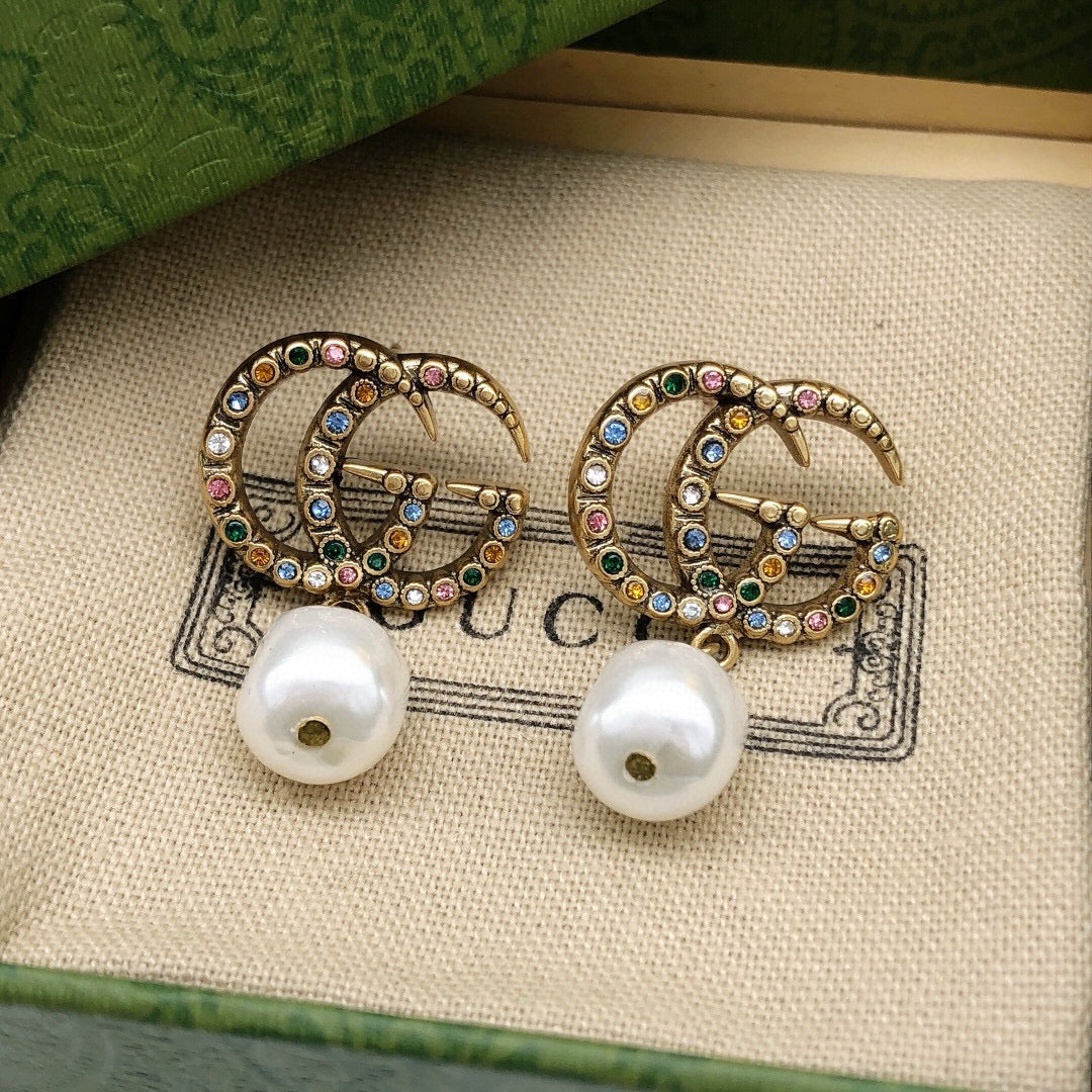 Geometric Emblem Stud Earrings in Polished Metal-Tone – Vintage Detail front product view