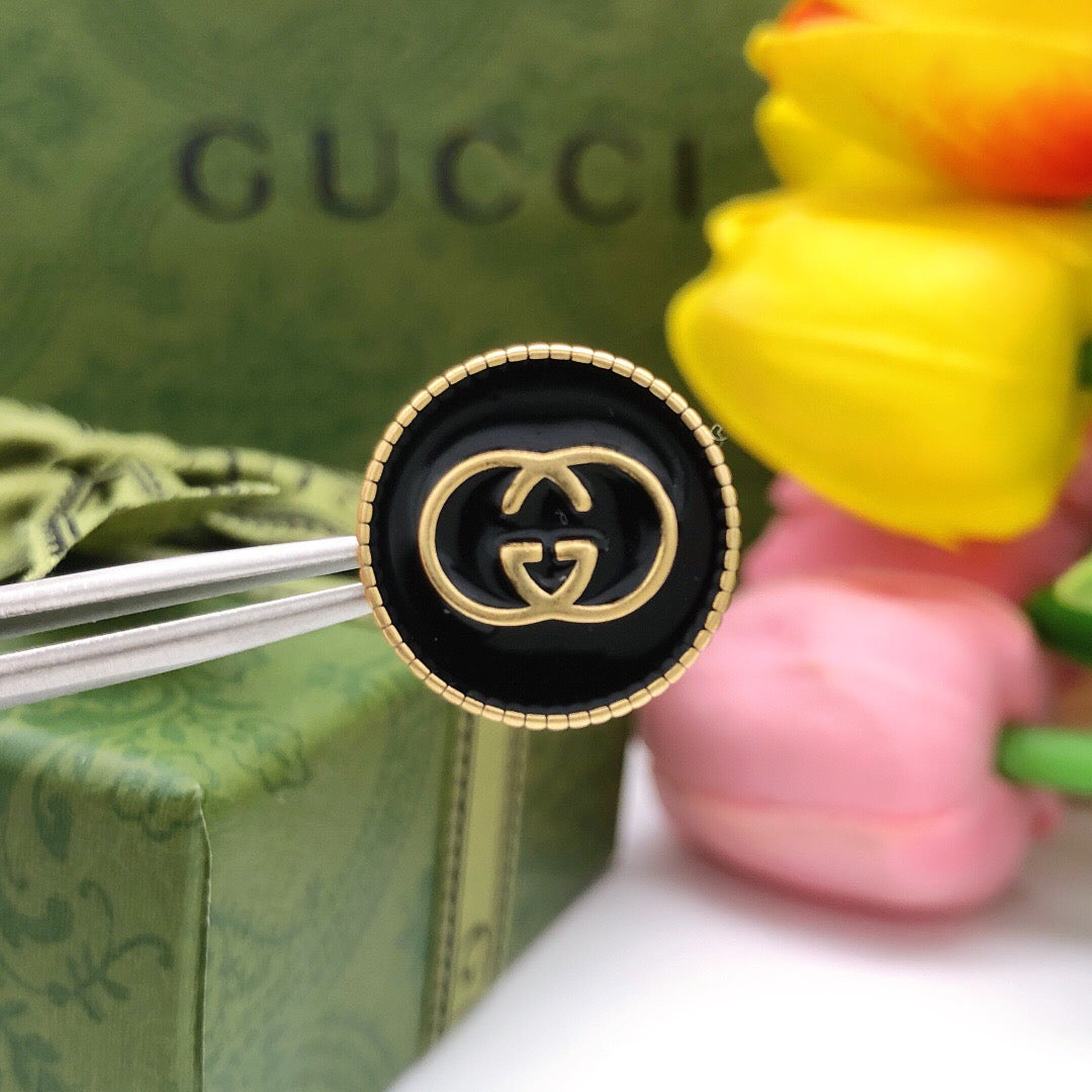 Double-G Emblem Stud Earrings in Polished Metal-Tone – Design 012 detail view