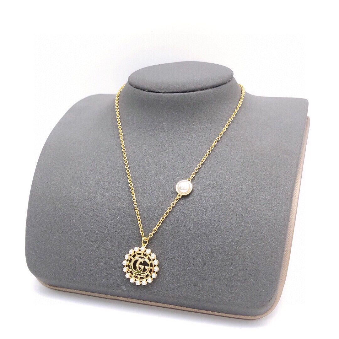 Double-G Emblem Pendant Necklace in Polished Metal-Tone – Design 059 close-up detail