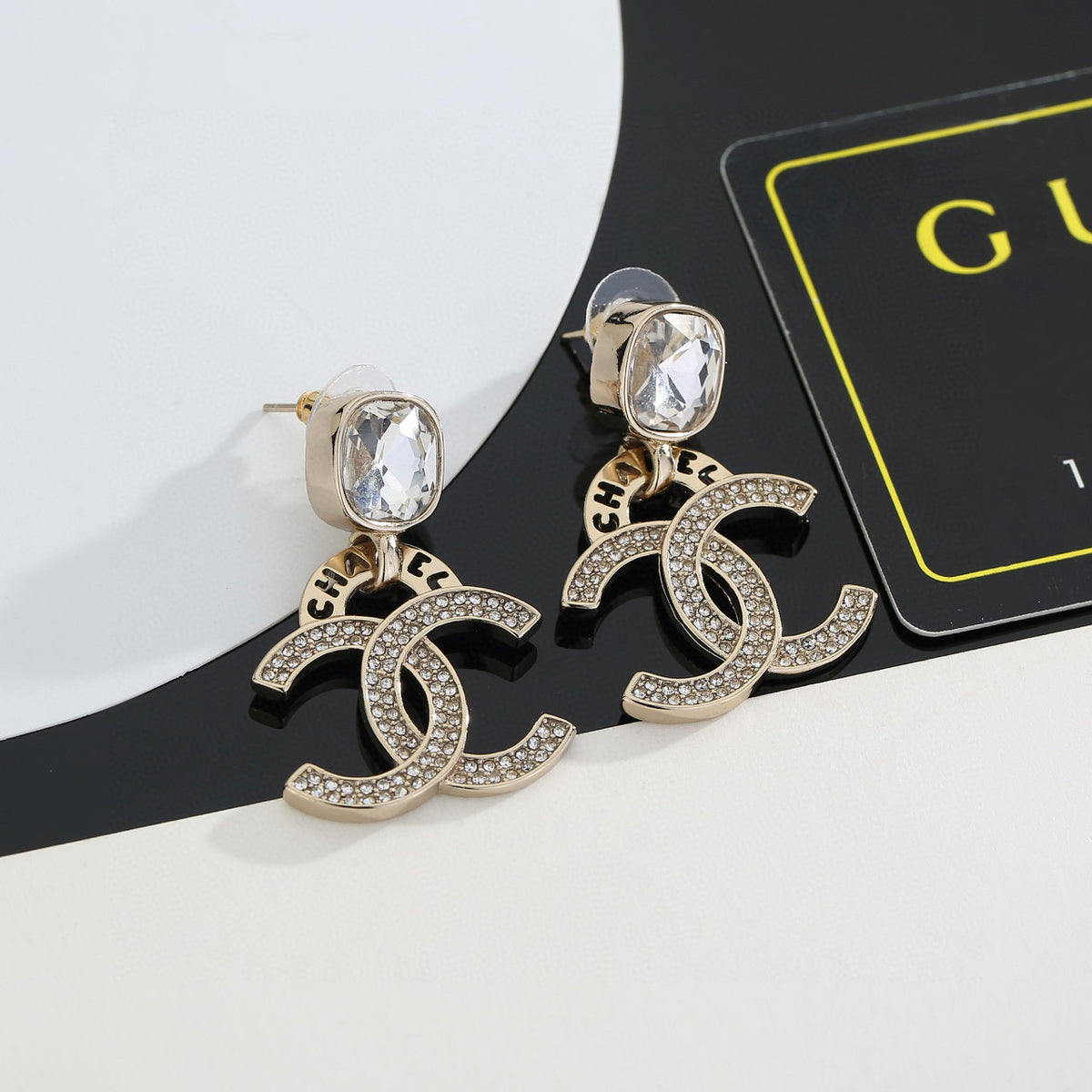 Double-C Emblem Stud Earrings in Gold-Tone – Design 012 detail view