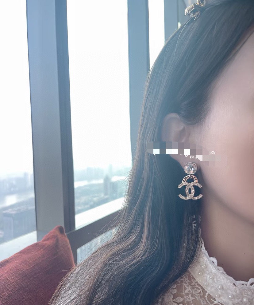 Double-C Emblem Stud Earrings in Gold-Tone – Design 034 close-up detail