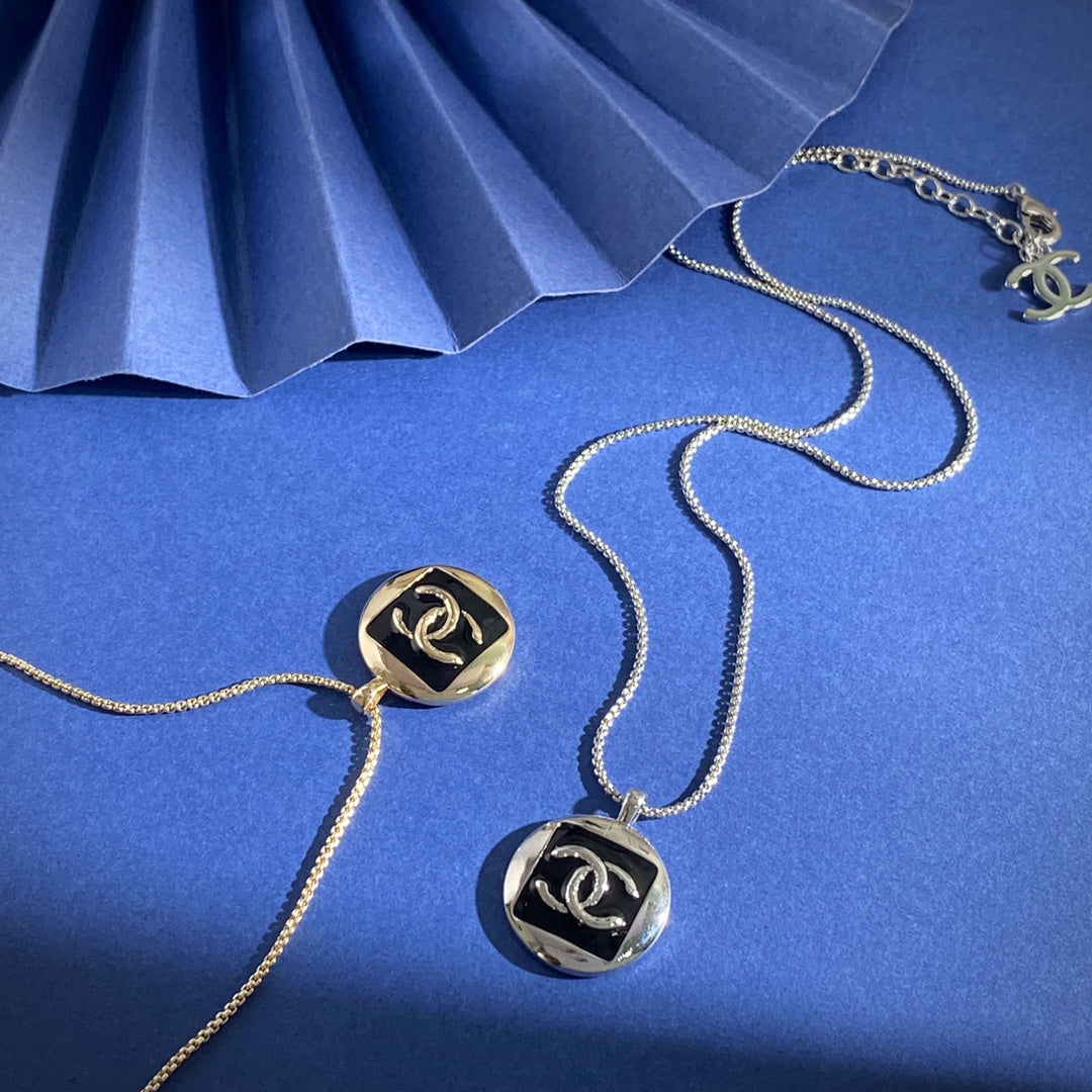 Double-C Emblem Pendant Necklace in Gold-Tone – Black Detail – Design 002 close-up detail