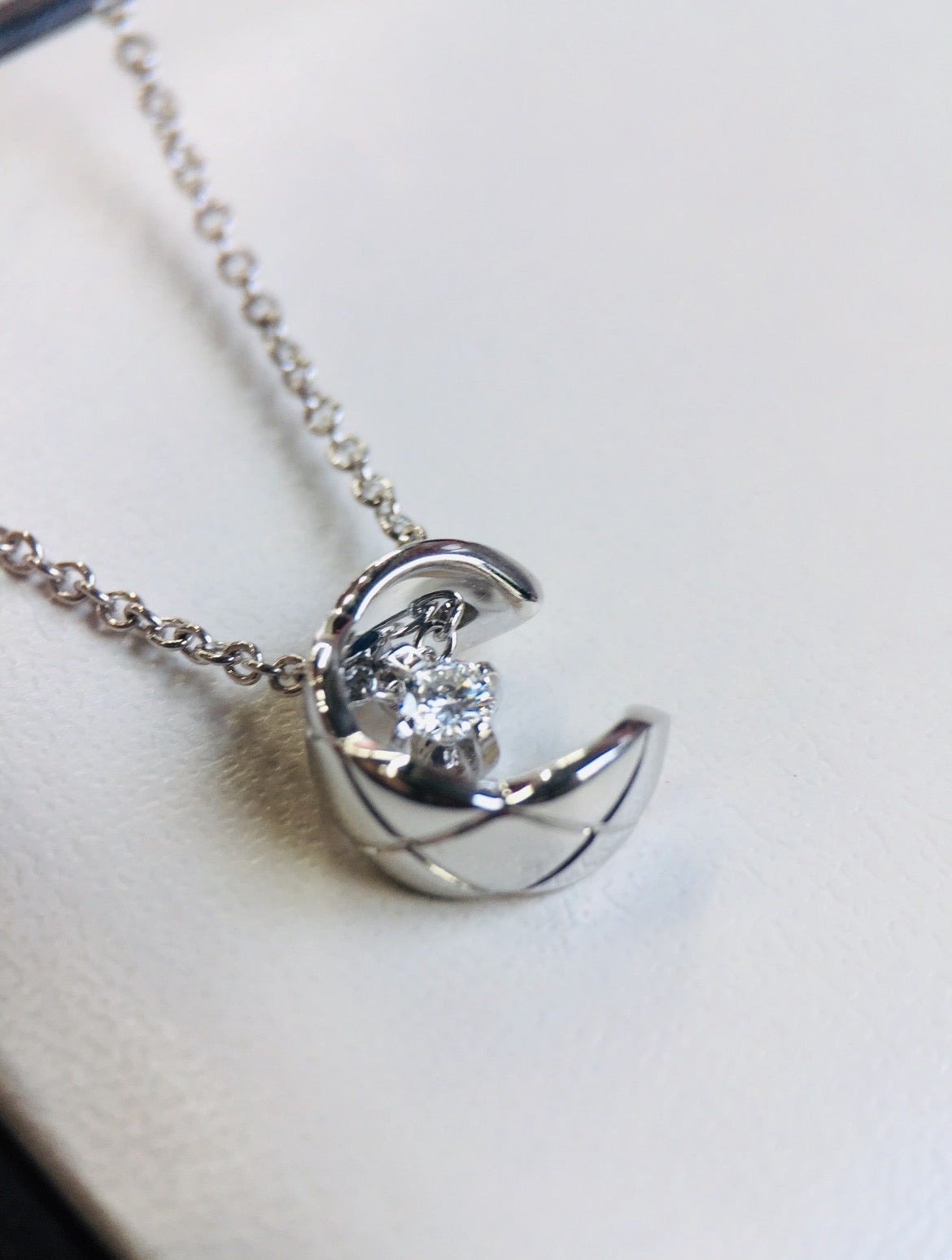 Signature Emblem Pendant Necklace in Silver-Tone – White Detail close-up detail
