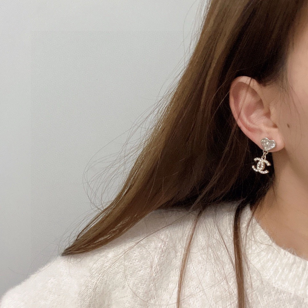 Double-C Emblem Stud Earrings in Polished Metal-Tone – Design 176 detail view