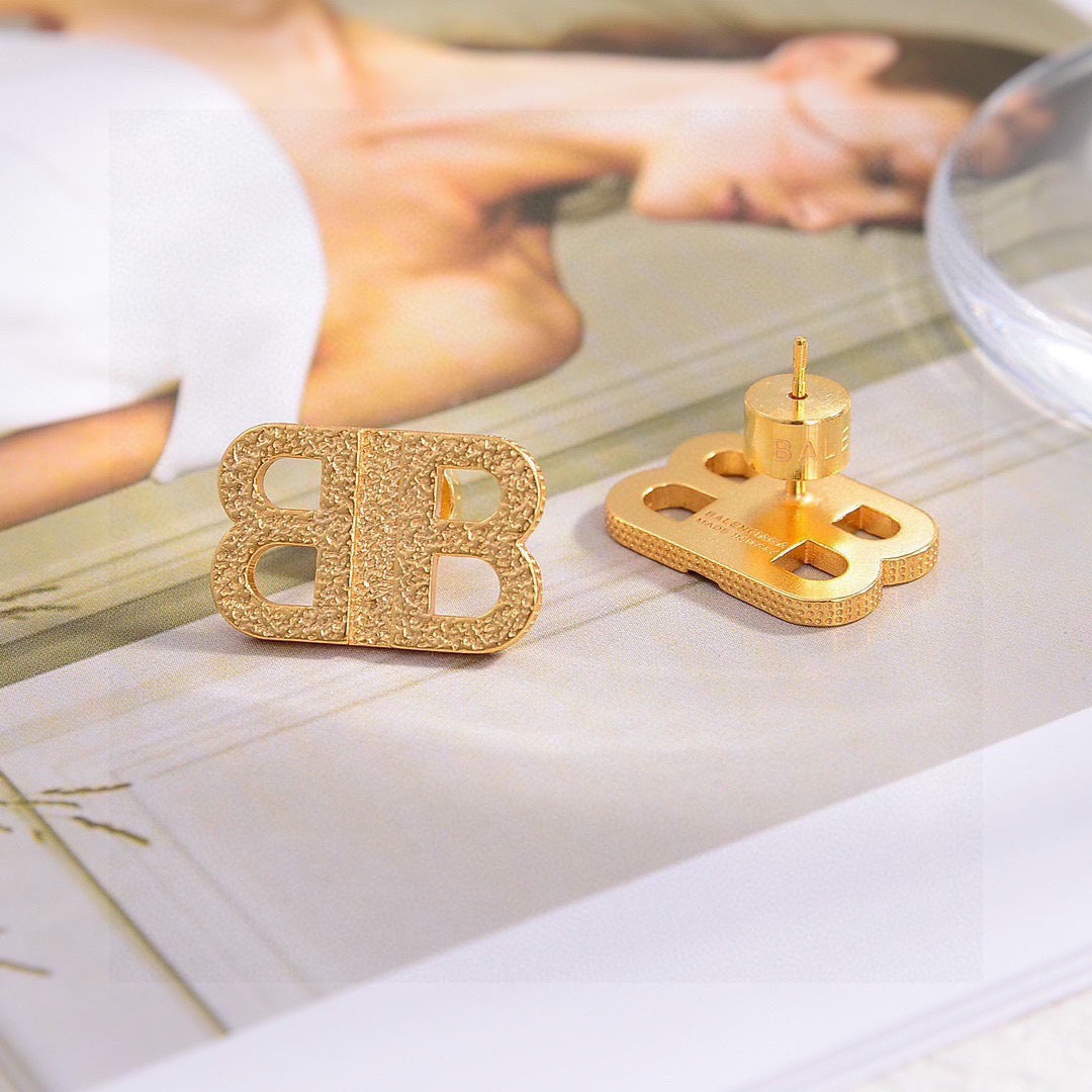 Geometric Emblem Stud Earrings in Gold-Tone – Design 010 styled product view